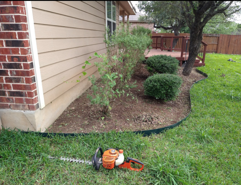 Shrub bed before fresh mulch was installed